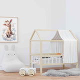 Affiche girafe dans les nuages illustrée, accrochée dans une chambre d'enfant