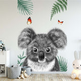 Deuxième vue du papier peint koala papillons dans une chambre d'enfant