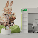 Papier peint panoramique lapin à vélo illustré, dans une chambre de bébé