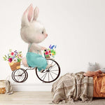 Papier peint panoramique lapin promenade à vélo illustré, dans une chambre d'enfant
