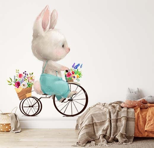 Papier peint panoramique lapin promenade à vélo illustré, dans une chambre d'enfant