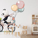 Papier peint panoramique panda ballade à vélo illustré, dans une chambre d'enfant