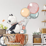 Deuxième vue du papier peint panda ballade à vélo dans une chambre d'enfant