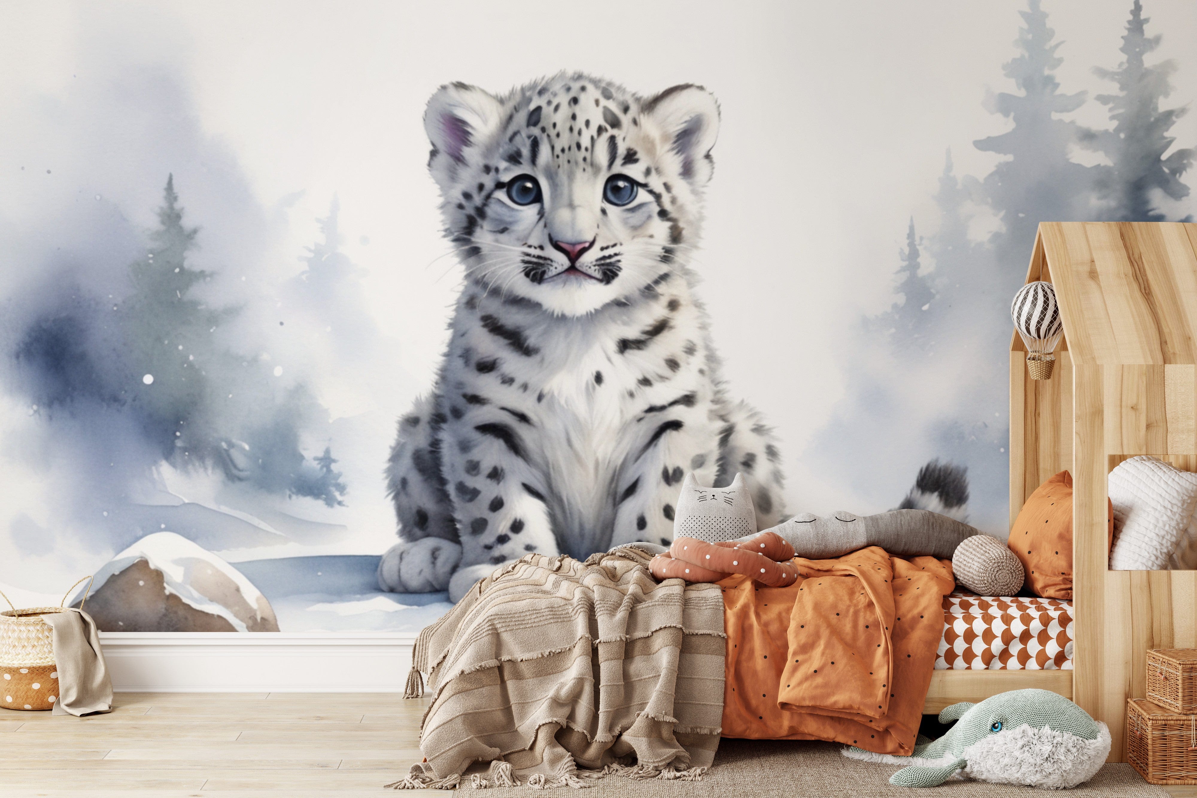 Papier peint panoramique panthère des neiges illustré, dans une chambre de bébé